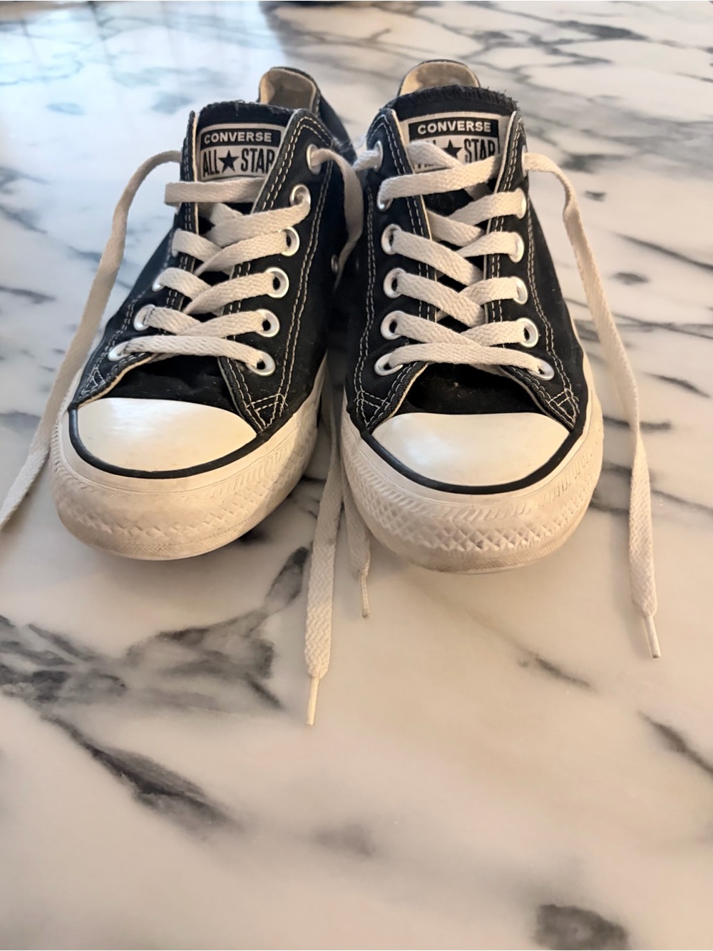 Converse women’s Low Top Sneakers in Black and White